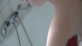 German babe rubbing shit on her naked body