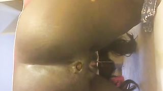 Ebony girl pooping a long turd in doggy style