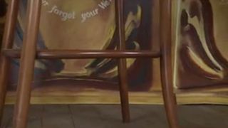 Hot brunette shitting on wooden chair
