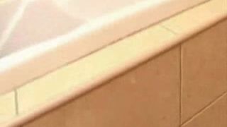 Brunette babe peeing in her own mouth