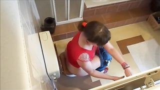 Mariska pooping in toilet