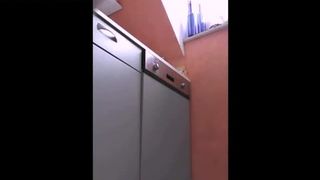 Hot brunette pooping on kitchen floor