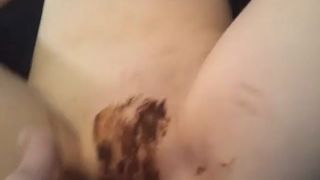 Sexy teen smearing poop on young pussy