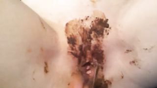 Sexy teen smearing poop on young pussy