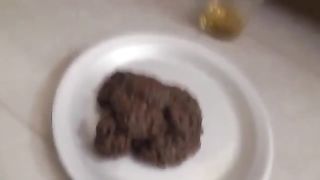 Young college girl pooping on plate