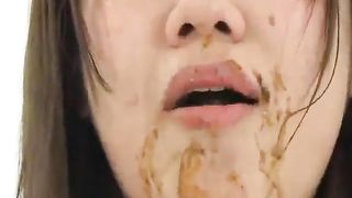 Asian teen eating poop with lunch