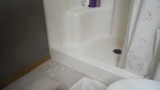 Mature lady pooping near a toilet