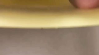 ASian teen shitting on a yellow chair