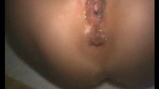 girl with sexy red cloth pissing over herself