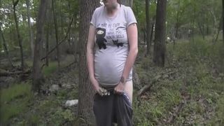 shaking her ass in the forest with a bit of poop