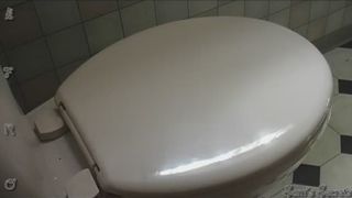 girl taking a big poop on the loo