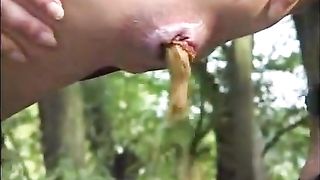 wild scat girl in the forrest covers herself in her own shit