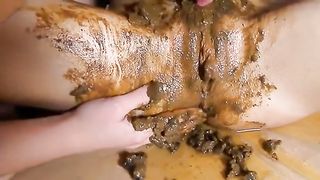 Two Russian girls smearing poop on each other