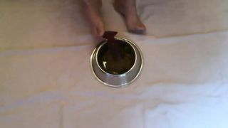 Chubby babe smearing crap on her feet