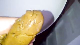Dirty woman sucking a long turd