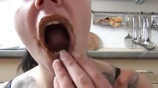 Sexy rocker girl rubbing shit on her face