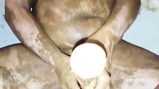 Fat mature woman rubbing poop on naked body