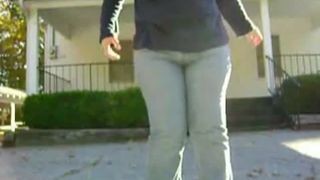 Sexy milf peeing in her pants in public