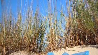 Brunette babe pooping at beach