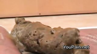 Romanian blonde girl pooping on a newspaper