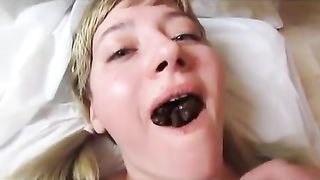 Beautiful blonde taking a scat load in mouth