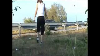 Tattooed girl pooping outdoor