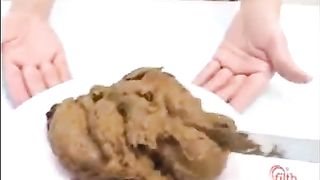 Asian teen eating poop with a fork