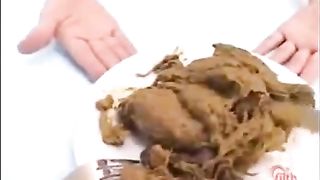 Asian teen eating poop with a fork