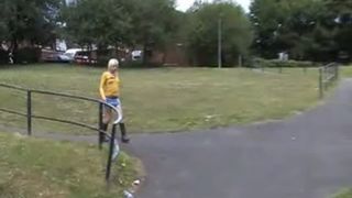 Blonde slut peeing under a bridge