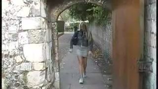 Blonde babe peeing on the street during the day