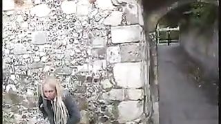 Blonde babe peeing on the street during the day