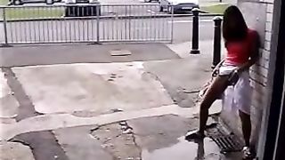 Asian teen peeing in the streets