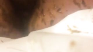 Smearing shit on her shaved pussy