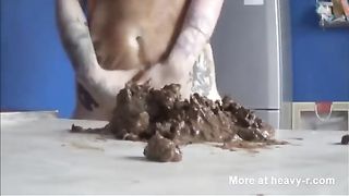 Tattooed redhead smears shit on her face
