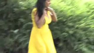 Brunette teen in yellow dress peeing