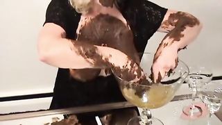 Mature woman smears poop on her face