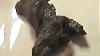 Sexy blonde shitting in kitchen