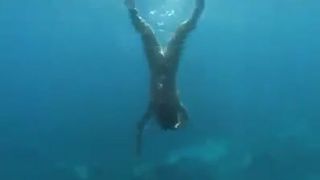 Mermaid shitting underwater
