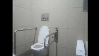 College teen shitting over toilet