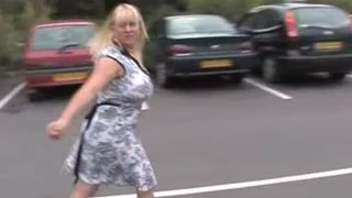 Chubby blonde peeing in a parking lot