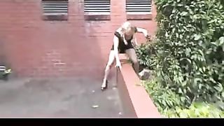 Pulled her black skirt up to pee