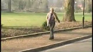 Blonde girl peeing outdoor