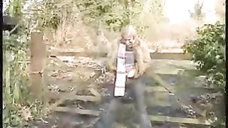 Blonde girl peeing outdoor