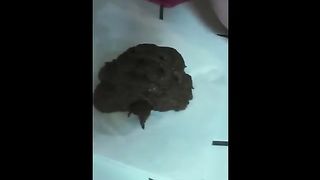 Beautiful brunette shitting a lot