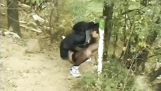 Blonde babe shitting in nature