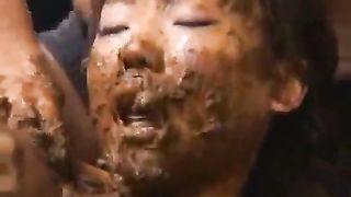 Forced to smear poop on her entire face
