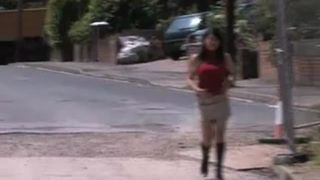 Asian girl peeing under a bridge