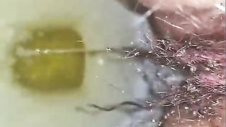 Attractive slut enjoys pissing gangbang action