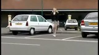 Blonde babe peeing near parking lot