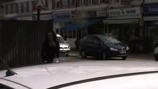 Hot babe peeing behind a parked car